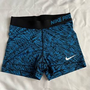 Blue and black pattern Nike pros